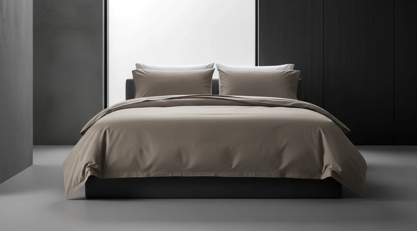 Stone bed linen by Linen and Co styled on a modern bed, showcasing sleek, premium bedding for hospitality and home.