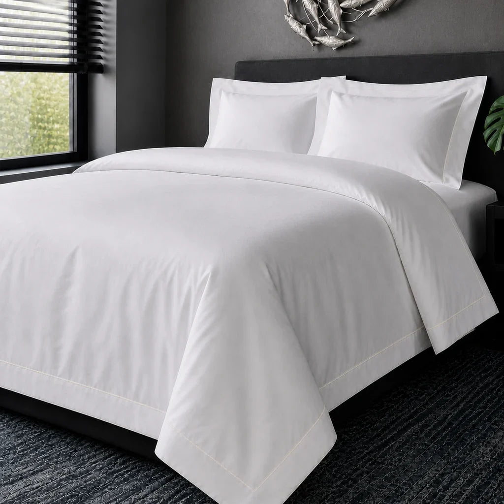 White cotton 200TC Oxford duvet cover set with cream one-row satin stitch – hero view | Linen & Co