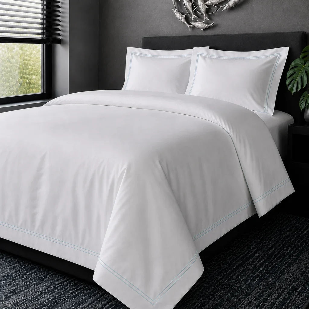 White cotton 200TC Oxford duvet cover set with duck egg two-row satin stitch – hero view | Linen & Co