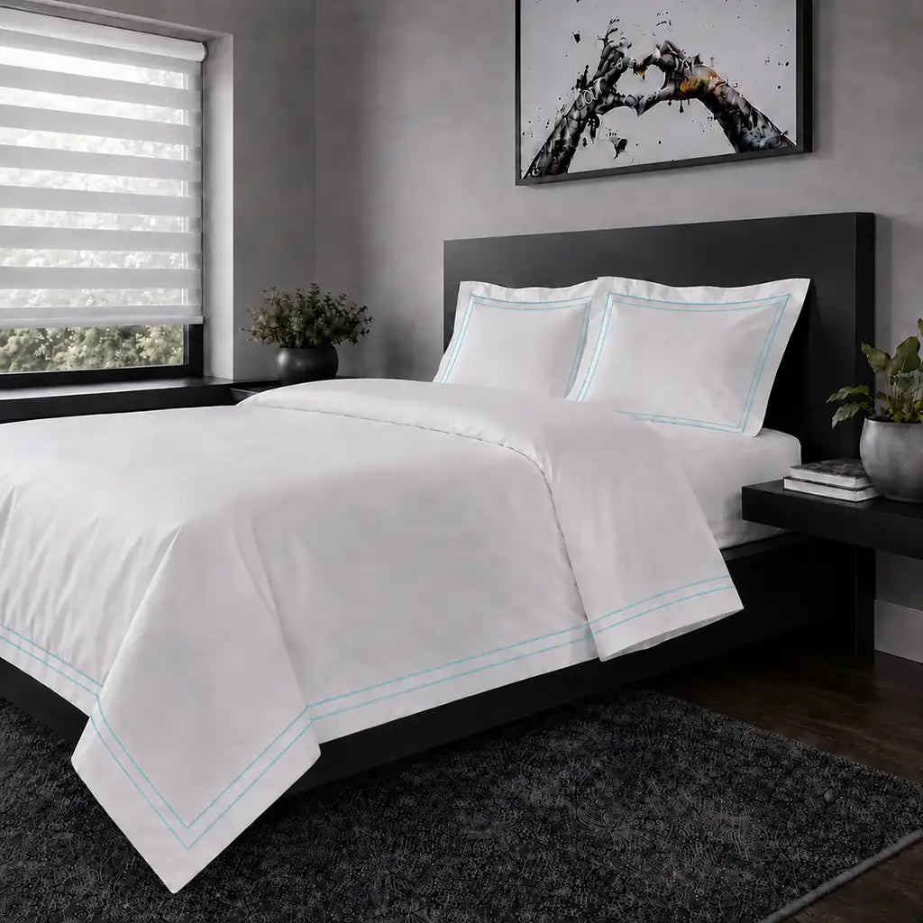 White polycotton percale Oxford duvet cover set with duck egg two-row satin stitch – hero view | Linen & Co