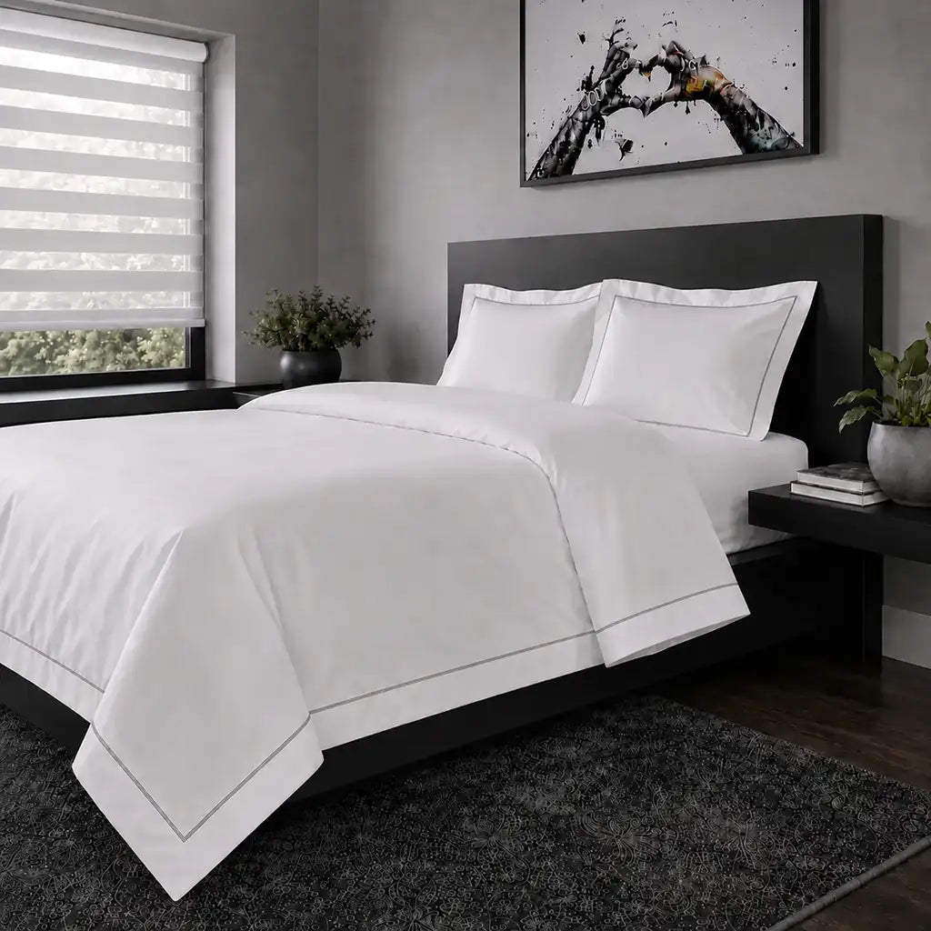White polycotton percale Oxford duvet cover set with grey one-row satin stitch – hero view | Linen & Co