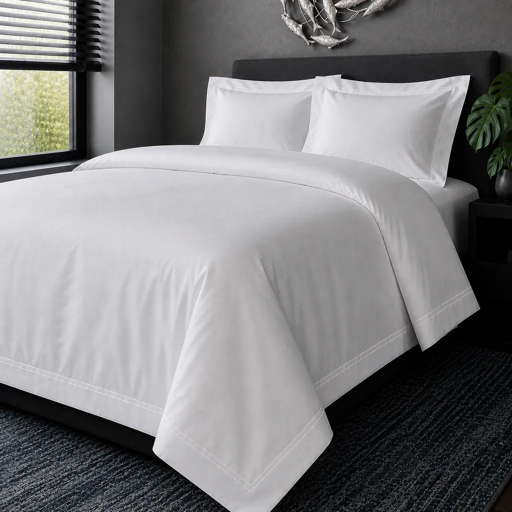 White cotton 200TC Oxford duvet cover set with white two-row satin stitch – hero view | Linen & Co