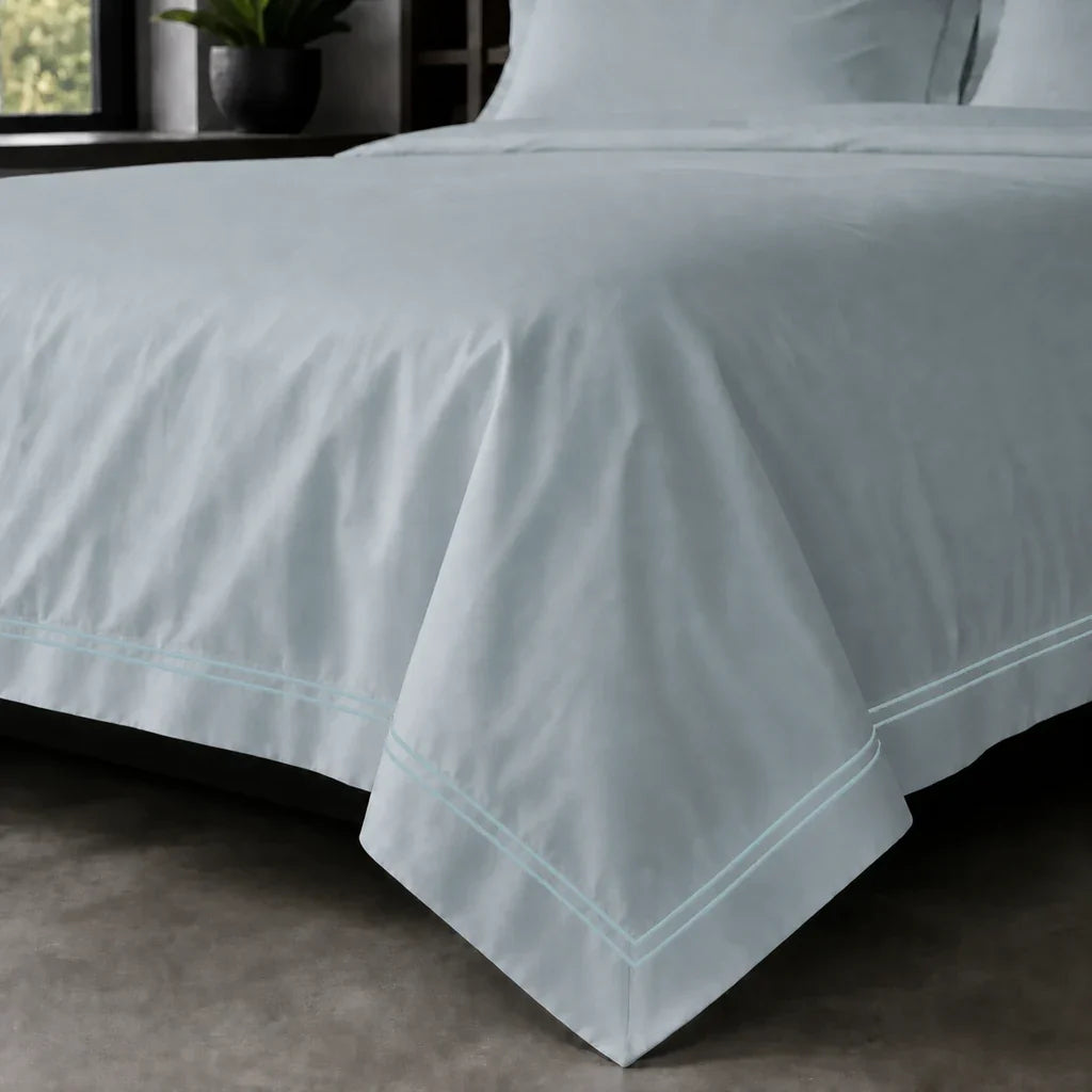 Duck Egg Oxford duvet cover set - Duck Egg Two Row Satin Stitch - on-the-bed corner view - Linen and Co