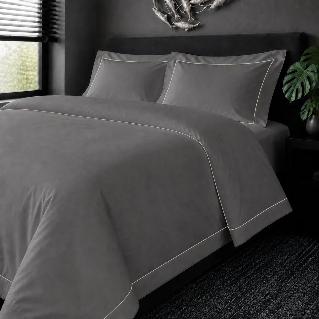 Grey cotton 200TC Oxford duvet cover set with cream one-row satin stitch – on the bed view | Linen & Co