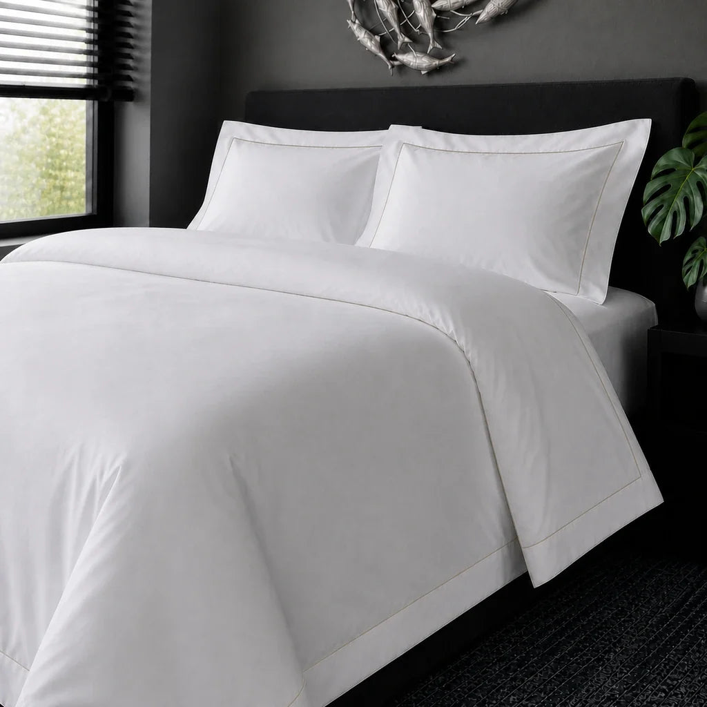 White cotton 200TC Oxford duvet cover set with stone one-row satin stitch – on-bed view | Linen & Co