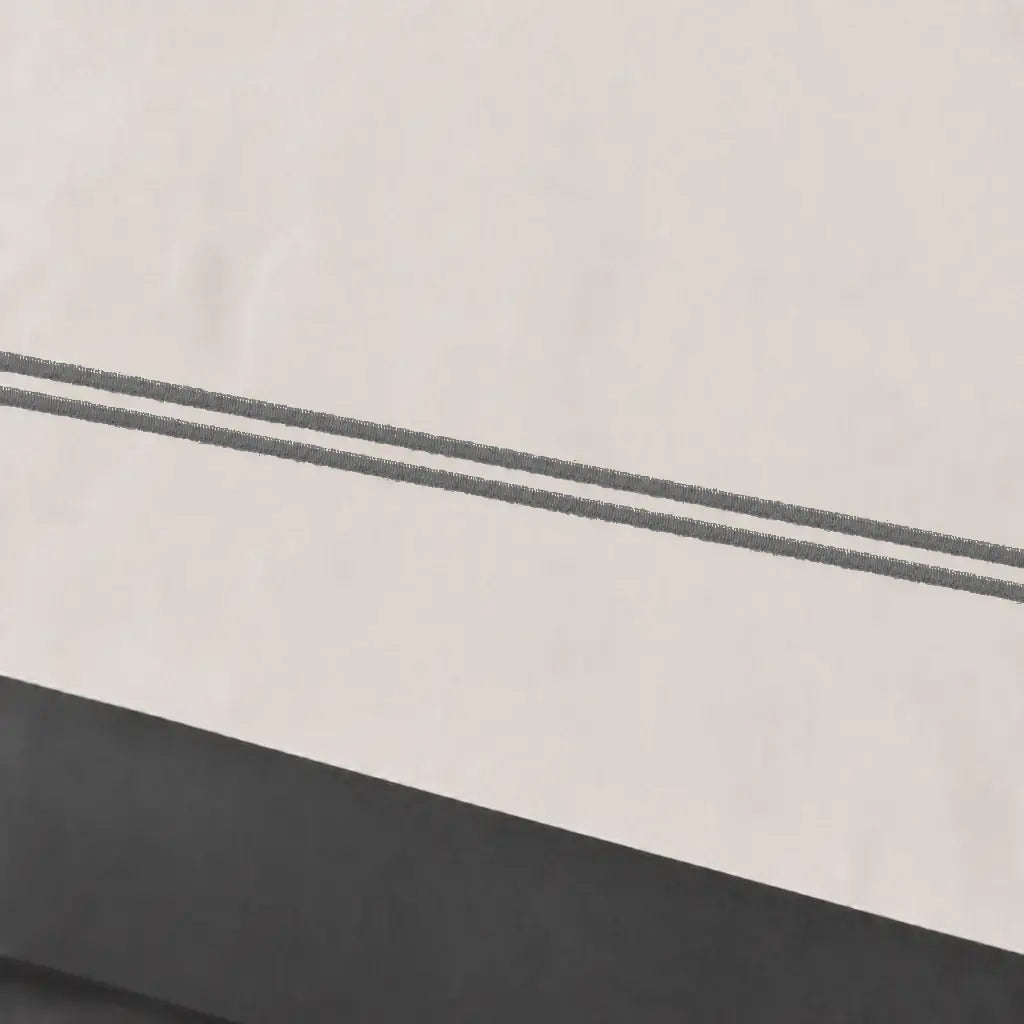 Close-up of cream polycotton percale 200TC Oxford cuff with grey two-row satin stitch - Linen and Co
