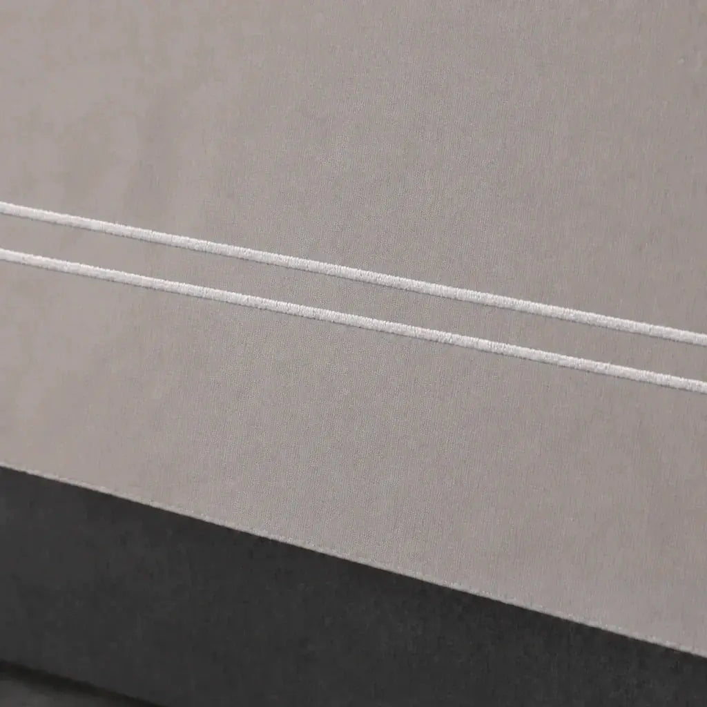 Close-up of the Stone Cotton 200TC Oxford duvet cover border with white two-row satin stitch.
