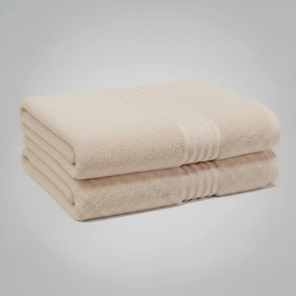High-quality beige bath towel from Linen and Co's Glodina Marathon range, illustrating superior absorbency and commercial-grade performance