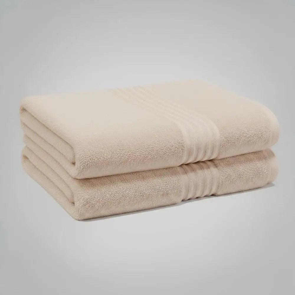 High-quality beige bath towel from Linen and Co's Glodina Marathon range, illustrating superior absorbency and commercial-grade performance