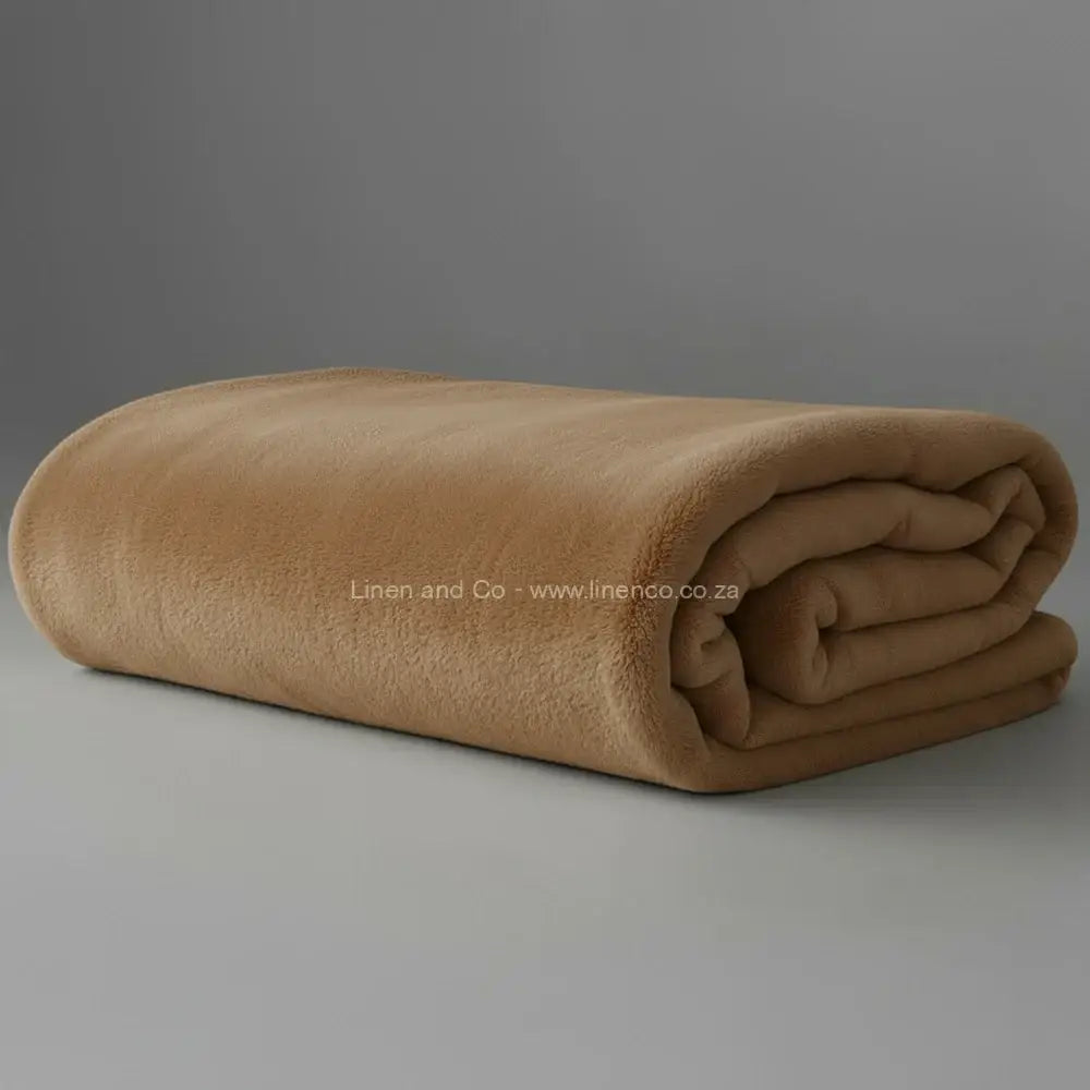 Cobblestone Belfiore luxury blanket neatly folded on light grey background - premium hospitality textile.