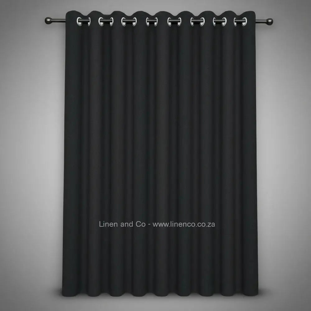 Charcoal grey eyelet woven blockout curtain with 70% shade reduction, professional hospitality-grade window treatment featuring refined texture and elegant tone for luxury interior design by Linen and Co