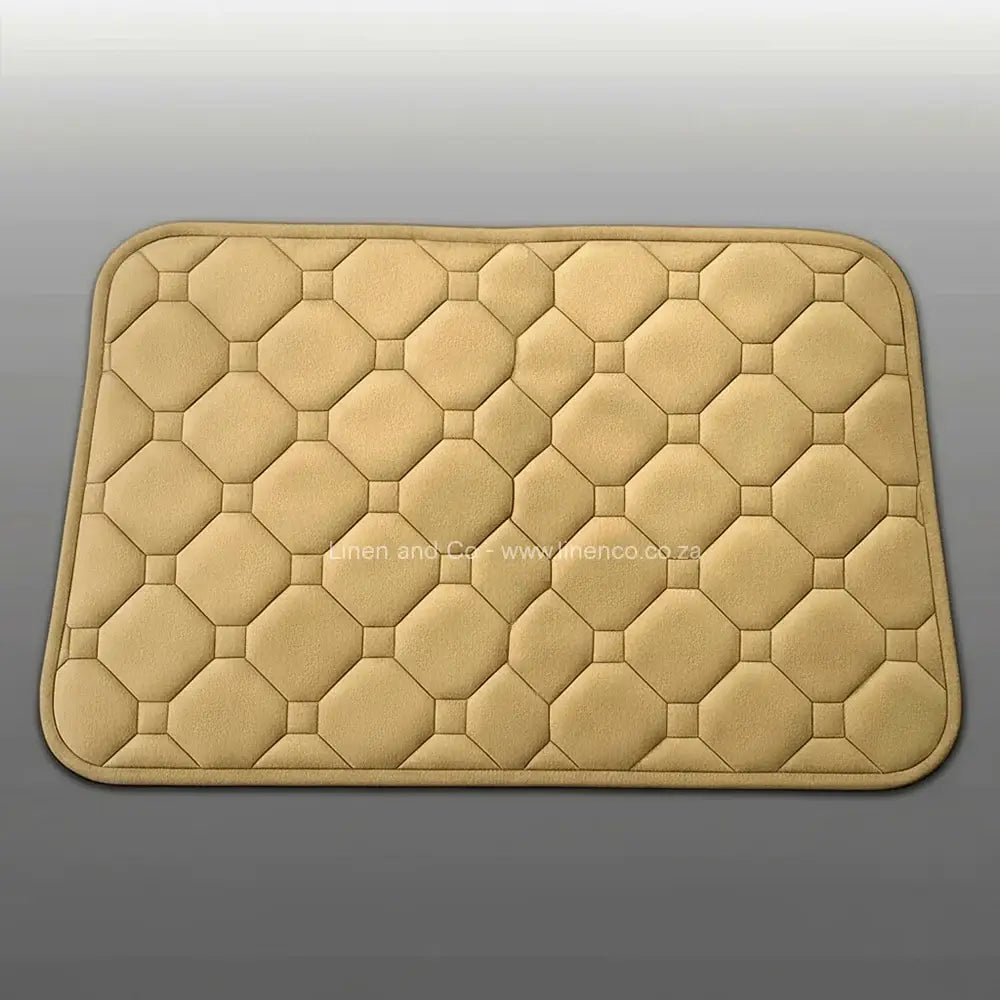 Stone memory foam bath mat by Linen & Co on soft grey gradient background, 50x80cm luxury microfibre bathroom accessory with non-slip backing