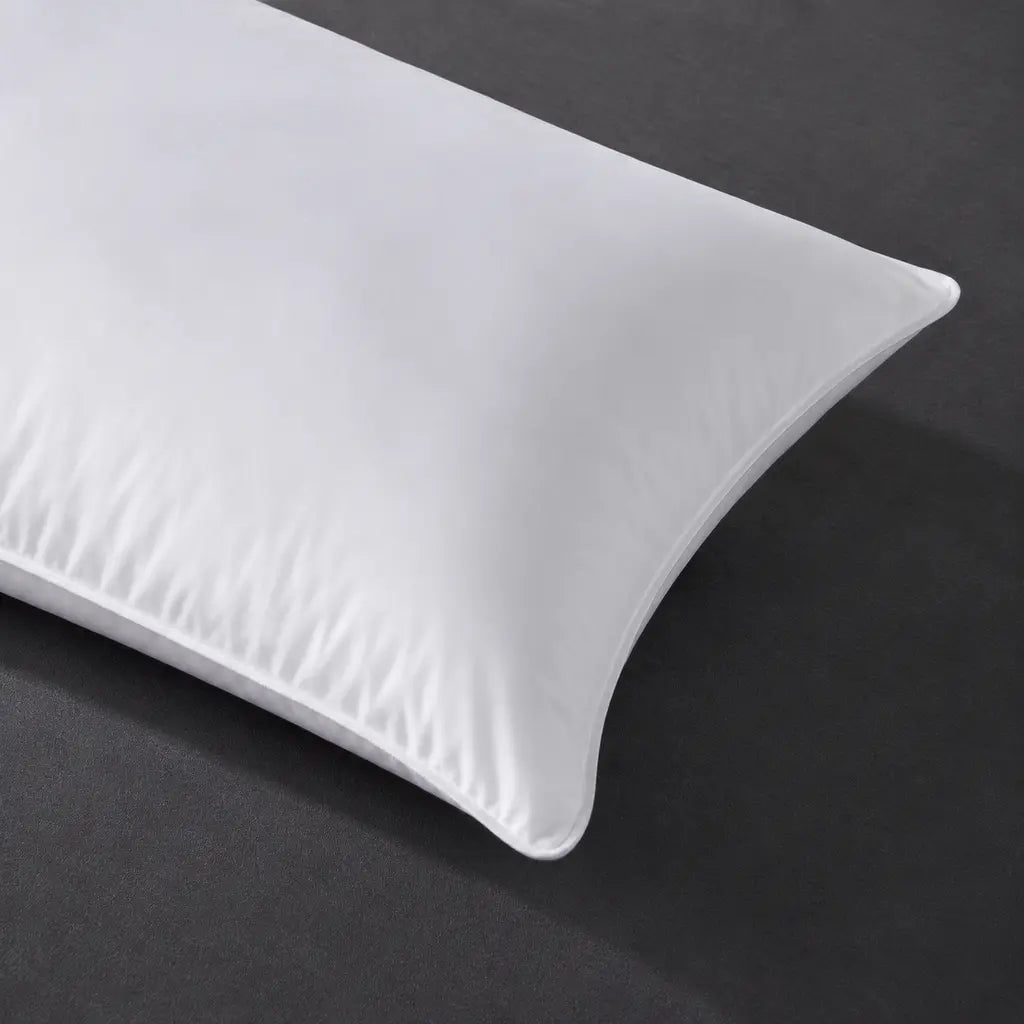 Close-up of the Bristol Sleep Luxury white microfibre pillow inner showing its smooth cotton shell and piped edge – Linen and Co