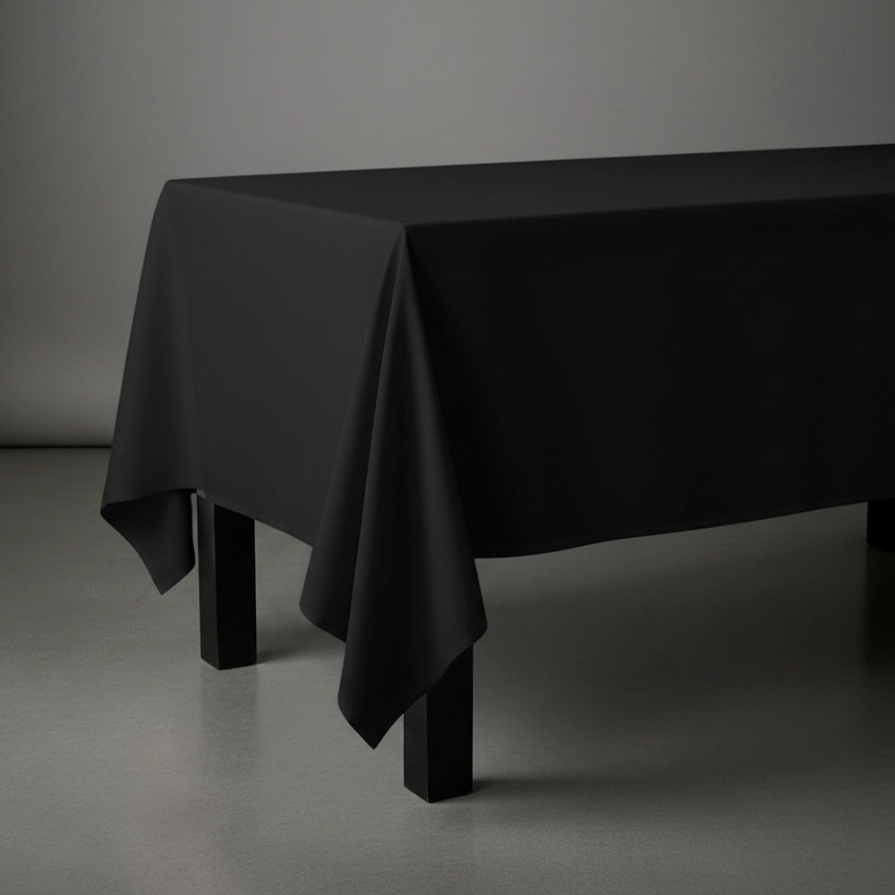 Black rectangle table cloth on wooden table by Linen and Co - premium hospitality table linen