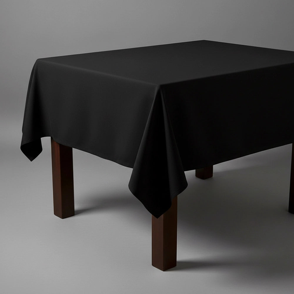 Black square table cloth on wooden table by Linen and Co - premium hospitality table linen