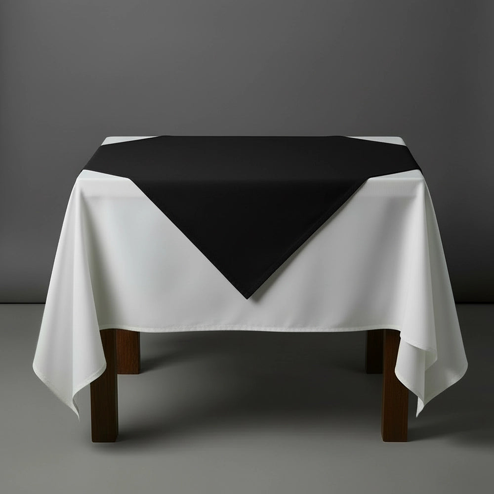 Black overlay on a white table cloth by Linen and Co - premium hospitality