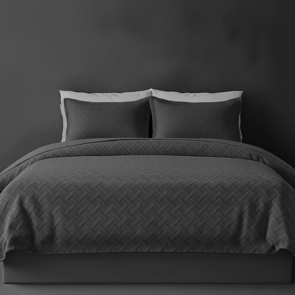 Charcoal Grey Italian Velvet bedspread on bed by Linen and Co - luxury hospitality bedspread with textured