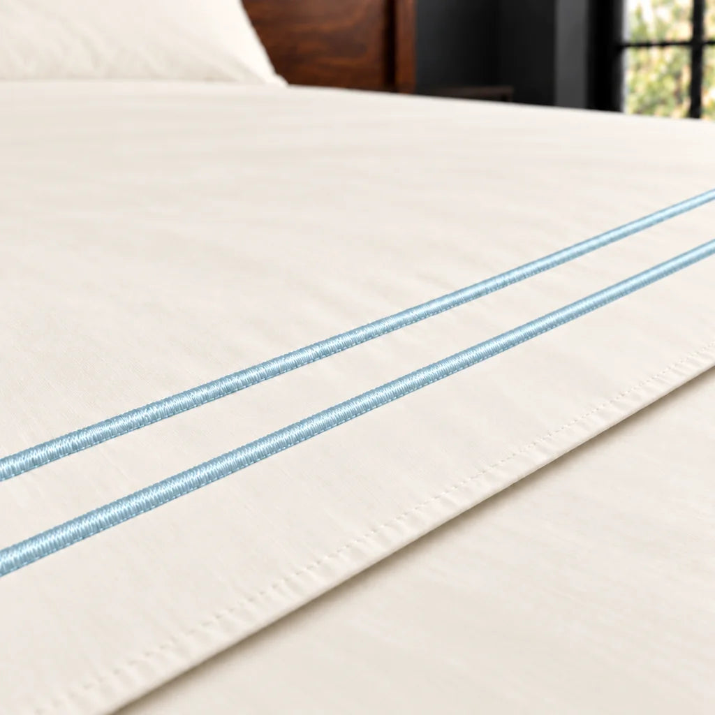 cream polycotton percale 200tc flat sheet, two row duck egg satin stitch — close up — Linen and Co