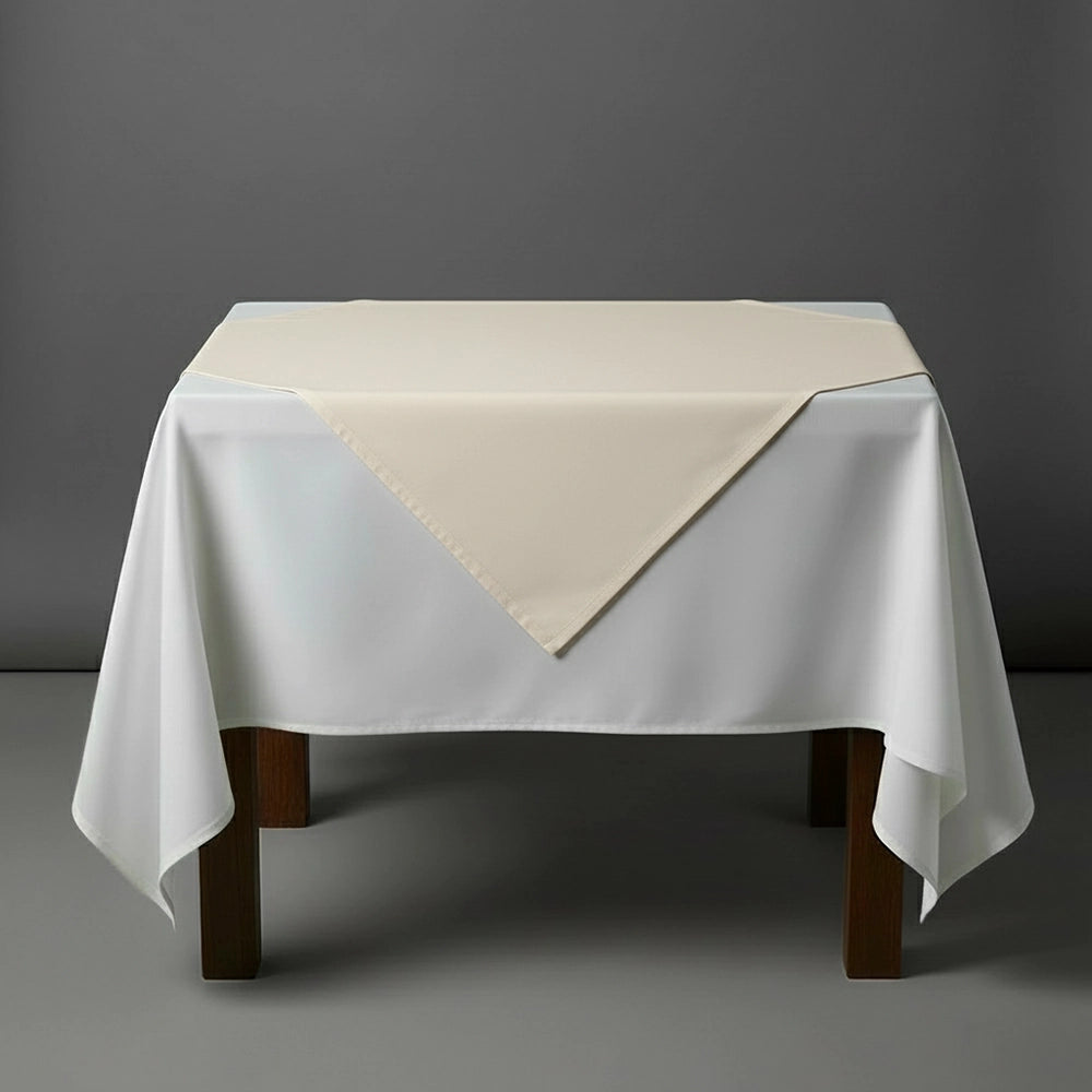 Cream overlay on a white table cloth by Linen and Co - premium hospitality