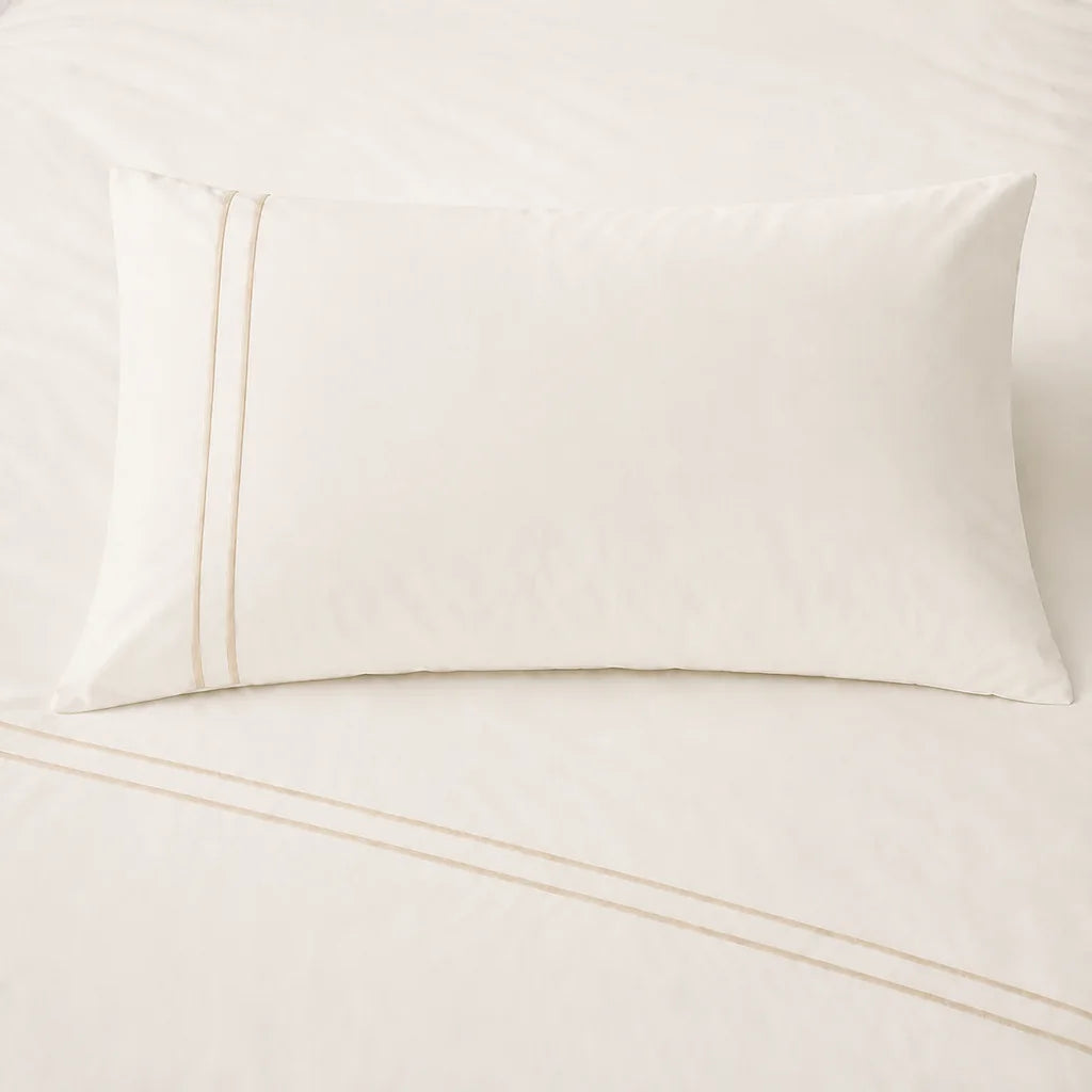 Cream 200TC cotton percale plain duvet cover set with Cream two row satin stitch - on the bed - Linen and Co