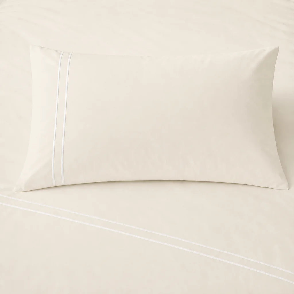 Cream 200TC cotton percale plain duvet cover set with White two row satin stitch - on the bed - Linen and Co