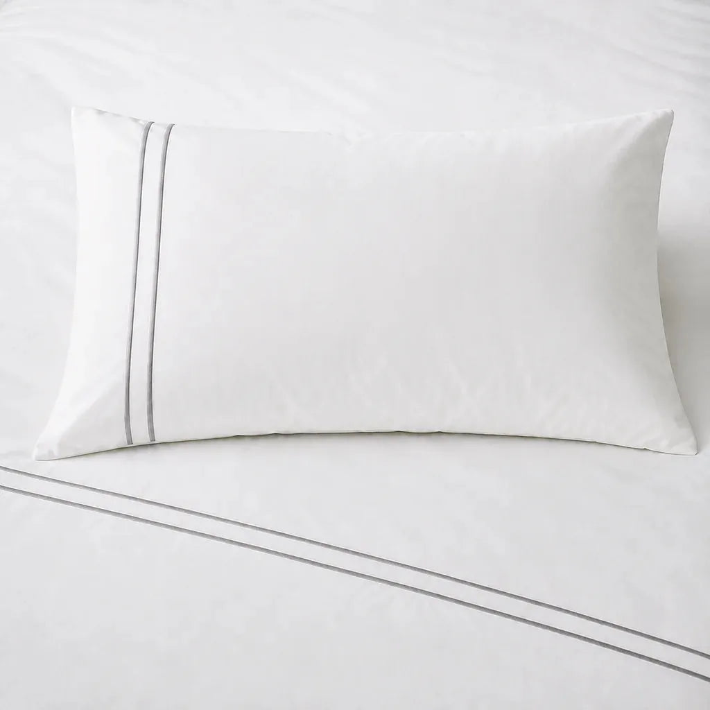 White 200TC plain duvet cover with Grey two row satin stitch - on the bed - Linen and Co