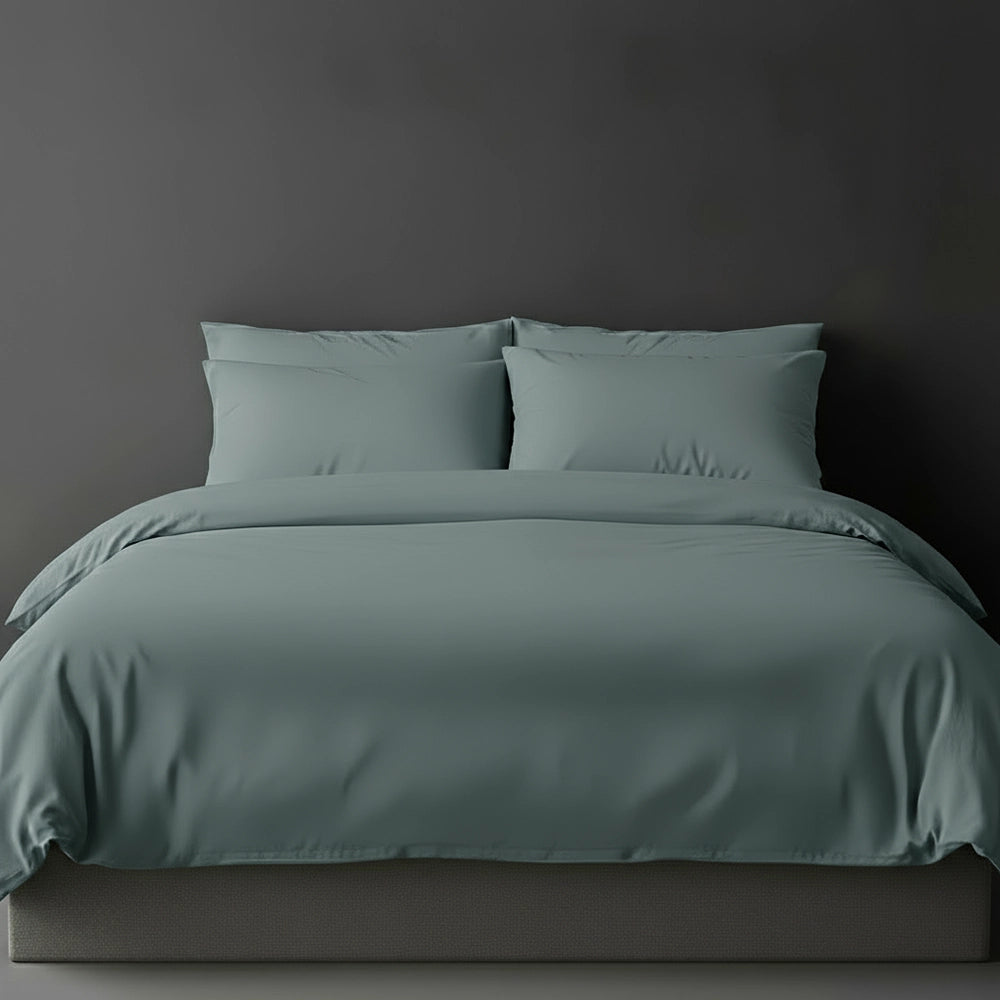 Duck Egg plain duvet cover with pillows on bed by Linen and Co - luxury hospitality bed linen