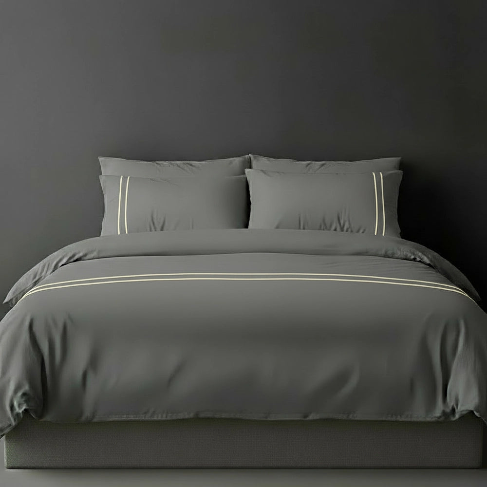 Grey duvet cover with cream satin stitch and pillows by Linen and Co - luxury bed linen