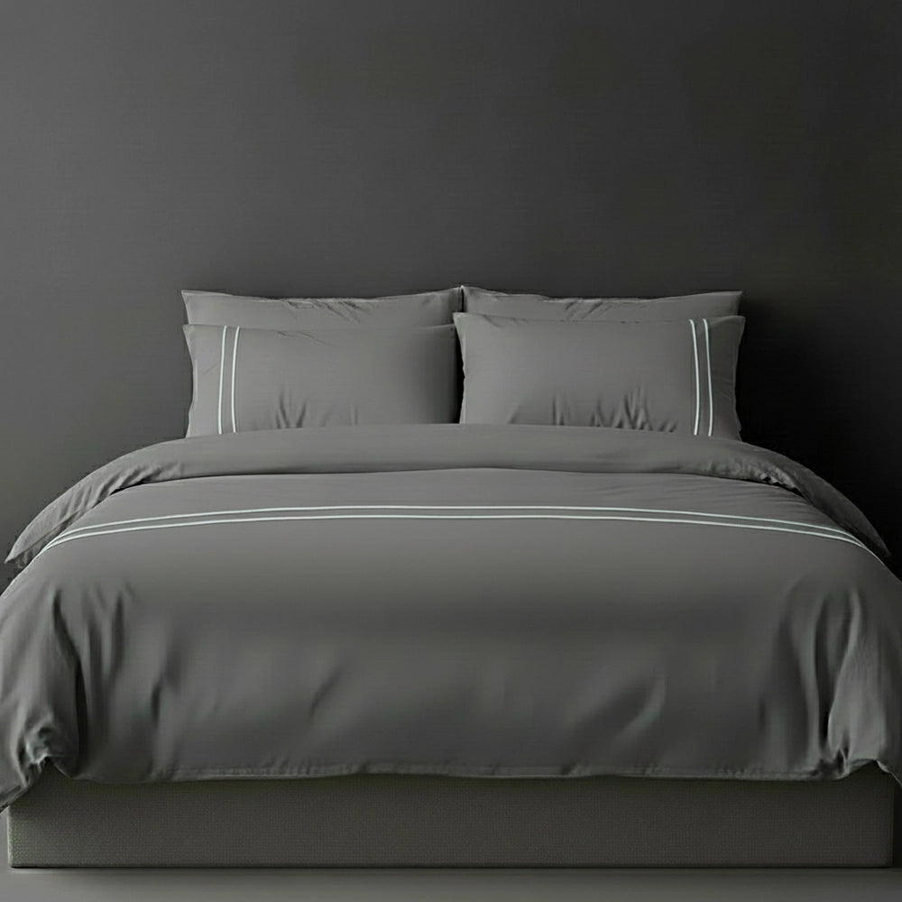 Grey duvet cover with grey satin stitch and pillows by Linen and Co - luxury bed linen