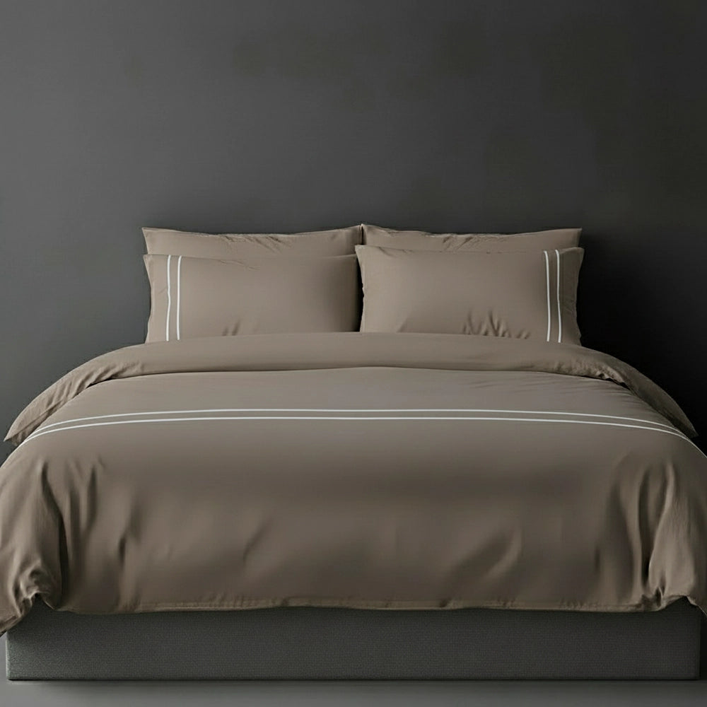 Stone duvet cover with grey satin stitch and pillows by Linen and Co - luxury bed linen