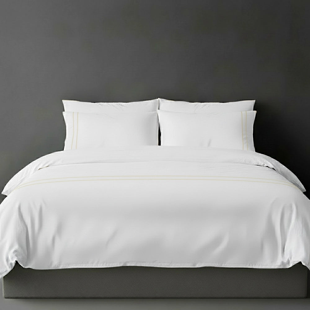 White duvet cover with cream satin stitch and pillows by Linen and Co - luxury bed linen