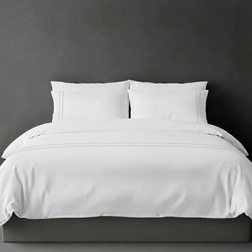 White duvet cover with duck egg satin stitch and pillows by Linen and Co - luxury bed linen