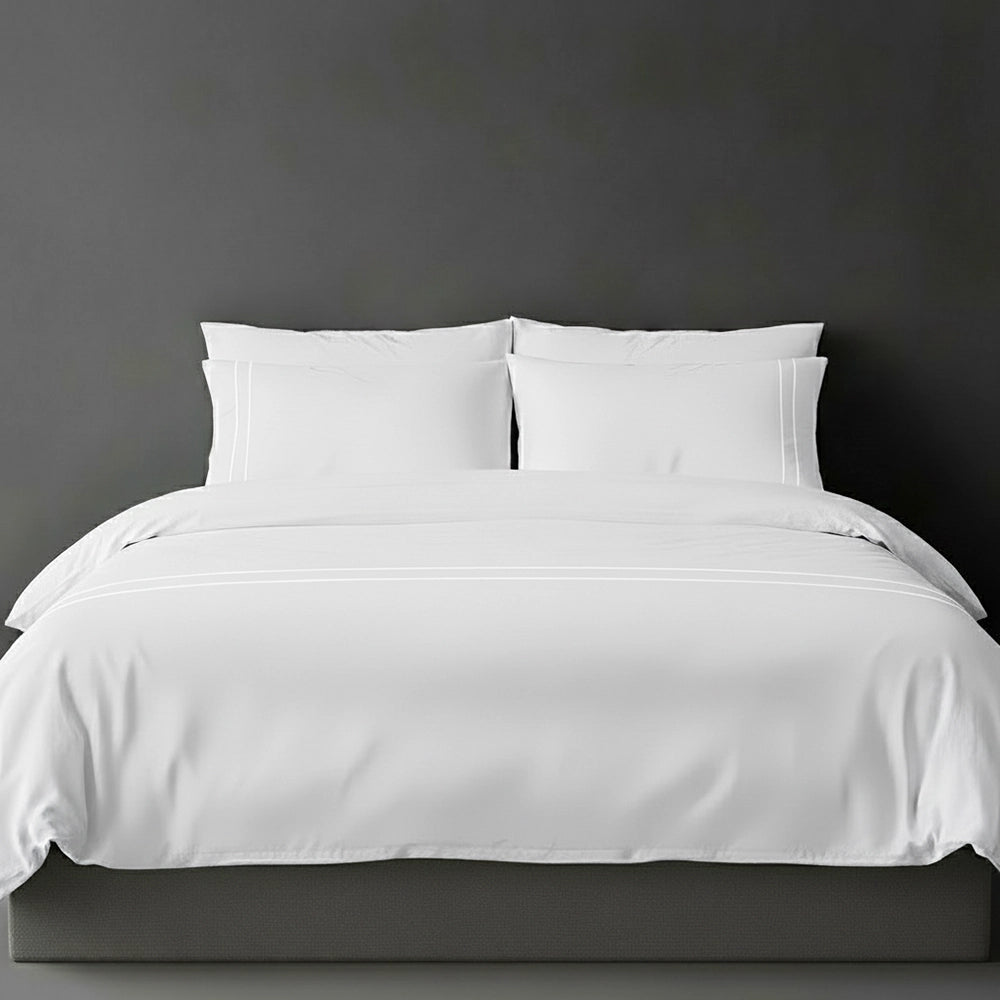 White duvet cover with white satin stitch and pillows by Linen and Co - luxury bed linen