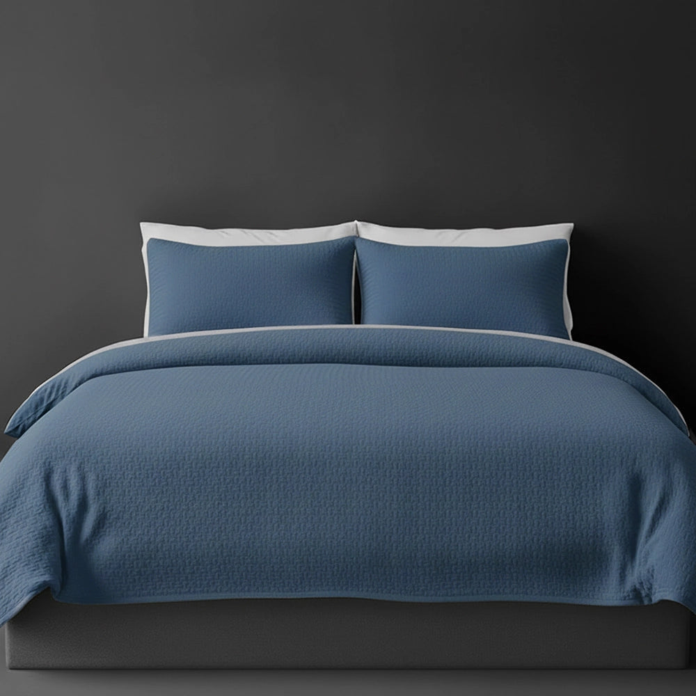 French Blue Berlin bedspread on bed by Linen and Co - luxury hospitality bedspread with textured finish