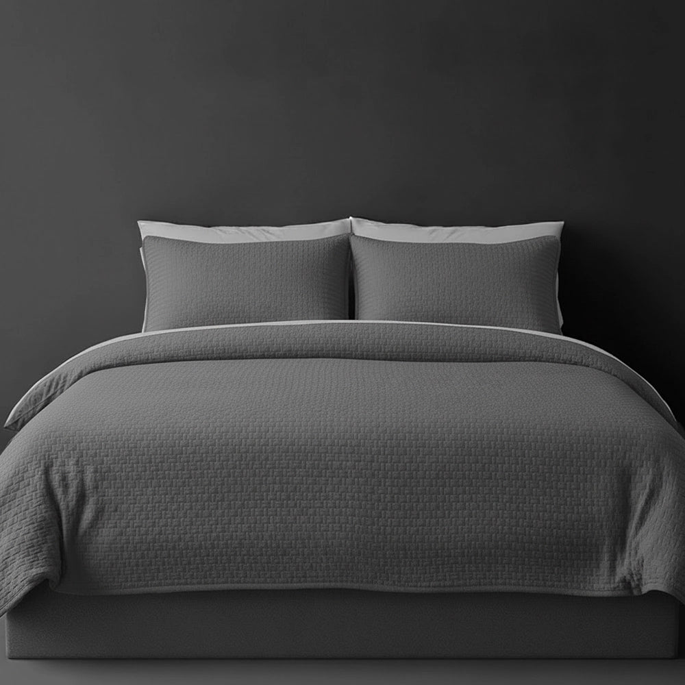Grey Berlin bedspread on bed by Linen and Co - luxury hospitality bedspread with textured finish