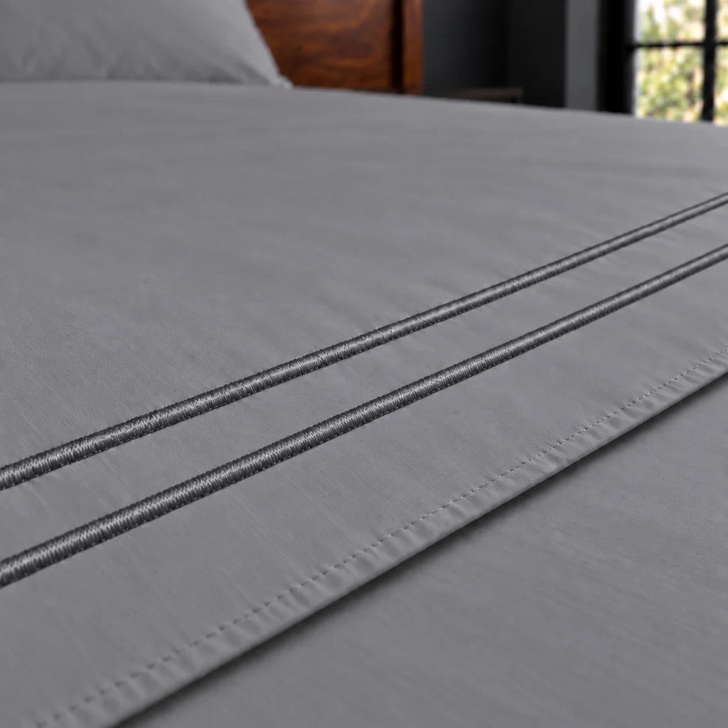 grey cotton percale 200tc flat sheet, two row grey satin stitch — close up — Linen and Co