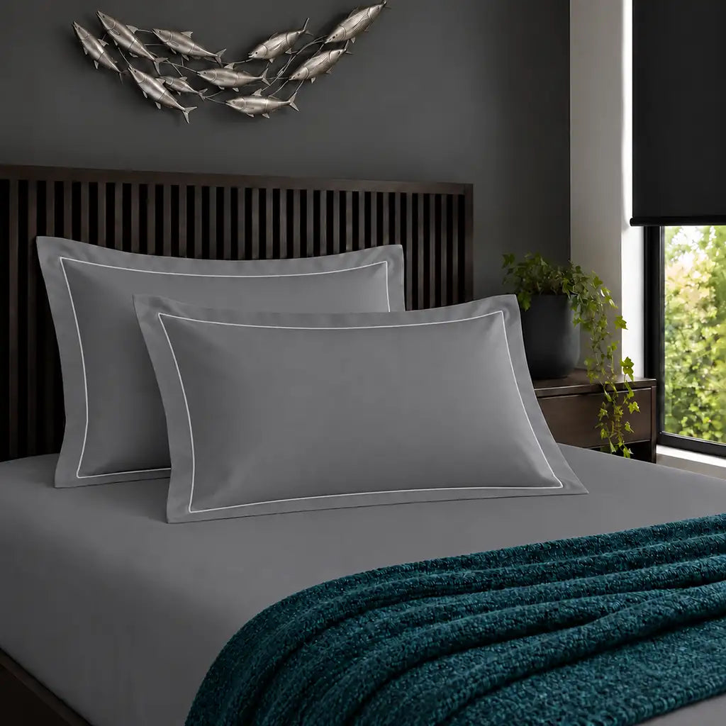 Oxford grey 200TC cotton percale pillowcases with one row white satin stitch border by Linen and Co