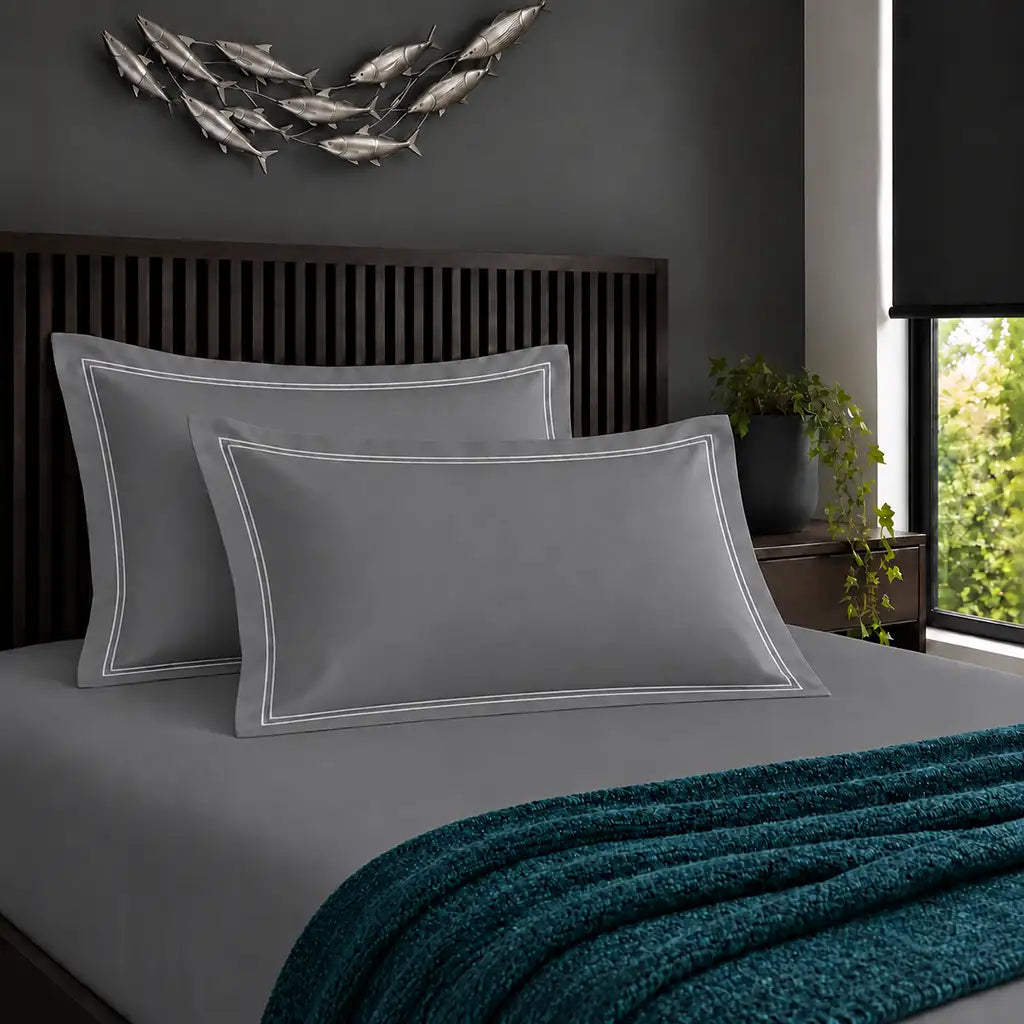 Oxford grey 200TC cotton percale pillowcases with two row white satin stitch border by Linen and Co
