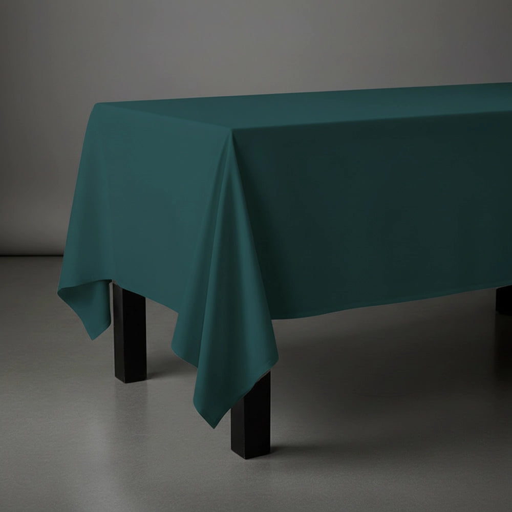 Hunter green rectangle table cloth on wooden table by Linen and Co - premium hospitality table linen