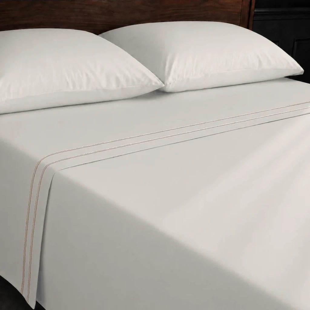 Ivory Cream 100% Cotton Percale 200TC flat sheet with Stone two-row satin stitch - on the bed - Linen and Co