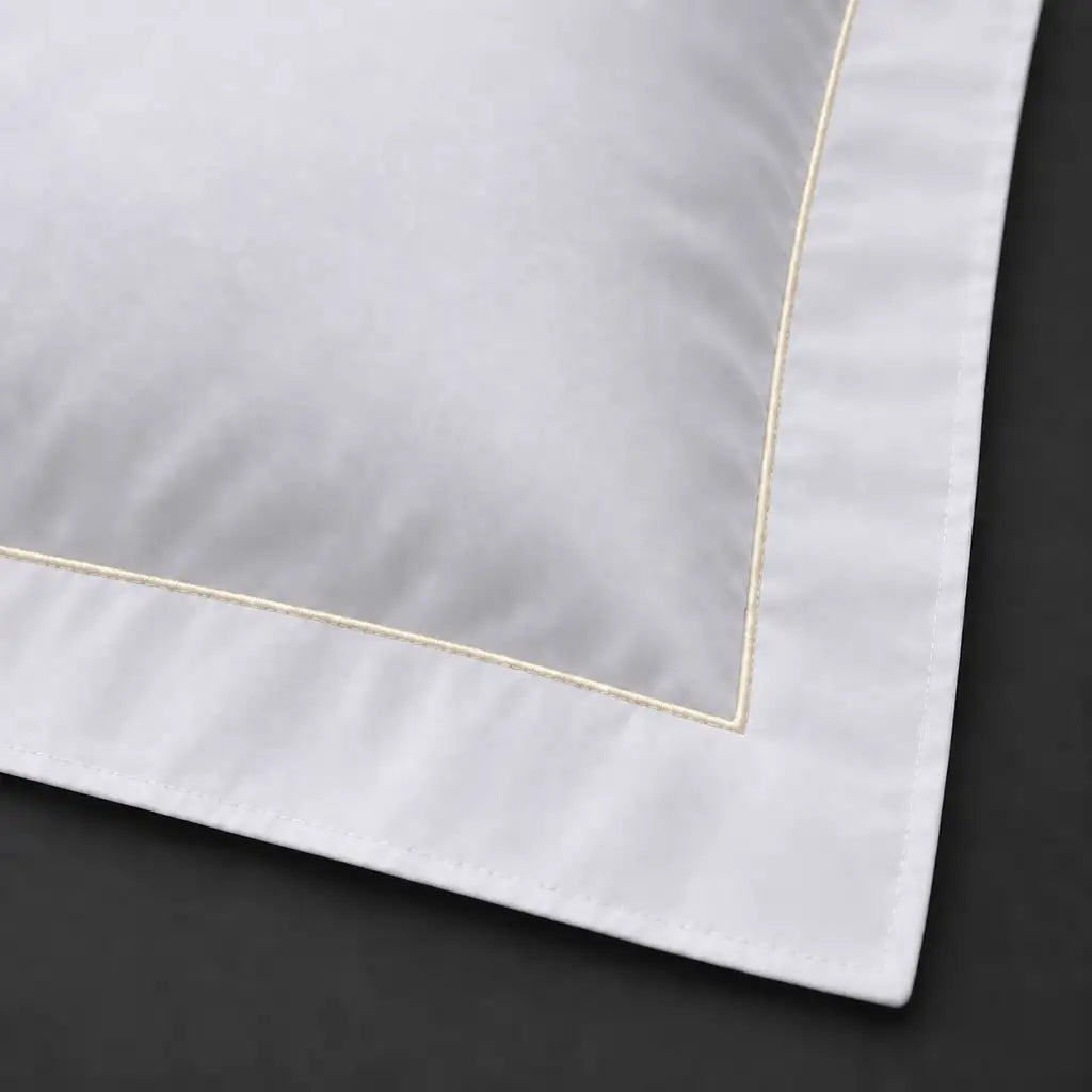 Close-up of white Oxford pillowcase with one row cream satin stitch border by Linen and Co