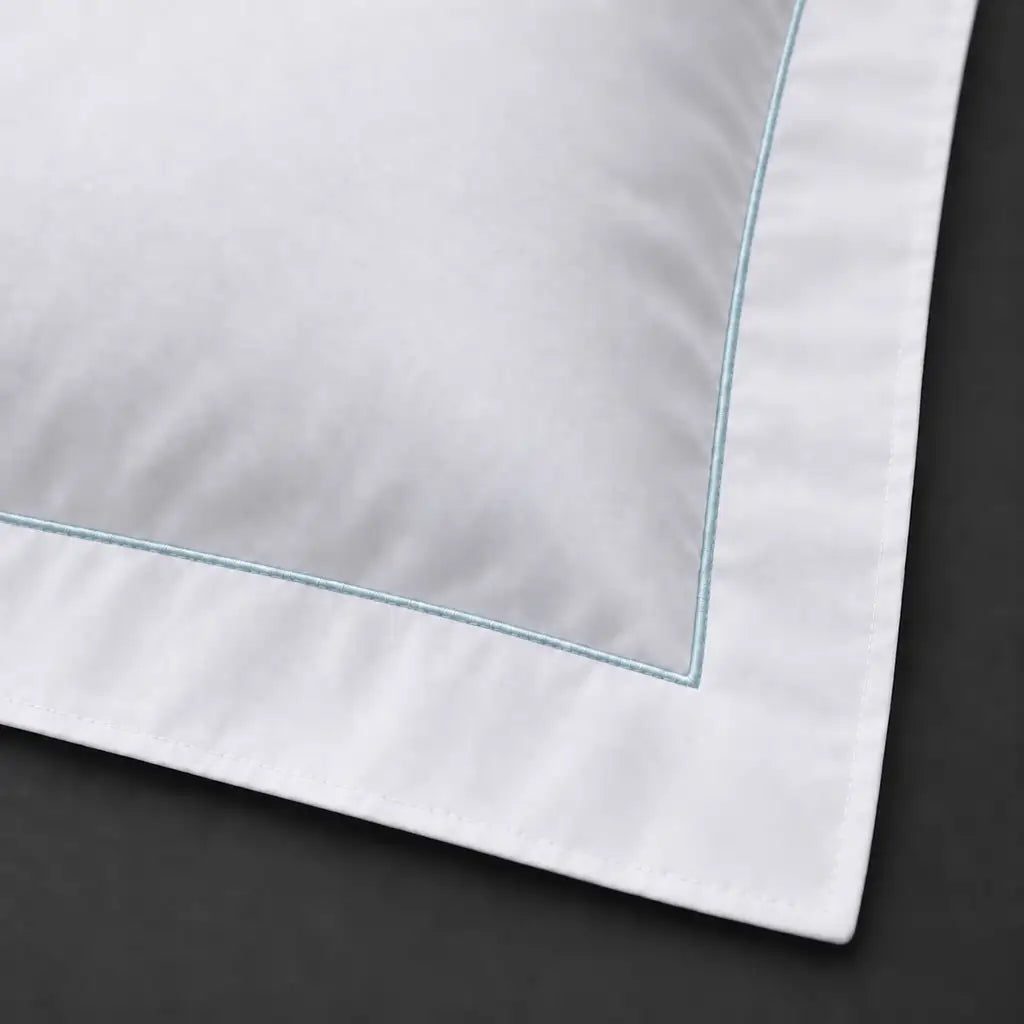 Close-up of white Oxford pillowcase with one row duck egg satin stitch border by Linen and Co
