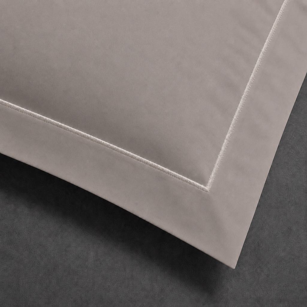 Stone polycotton percale 200TC Oxford pillow case, Standard and King, natural cream one row satin stitch — close-up detail.