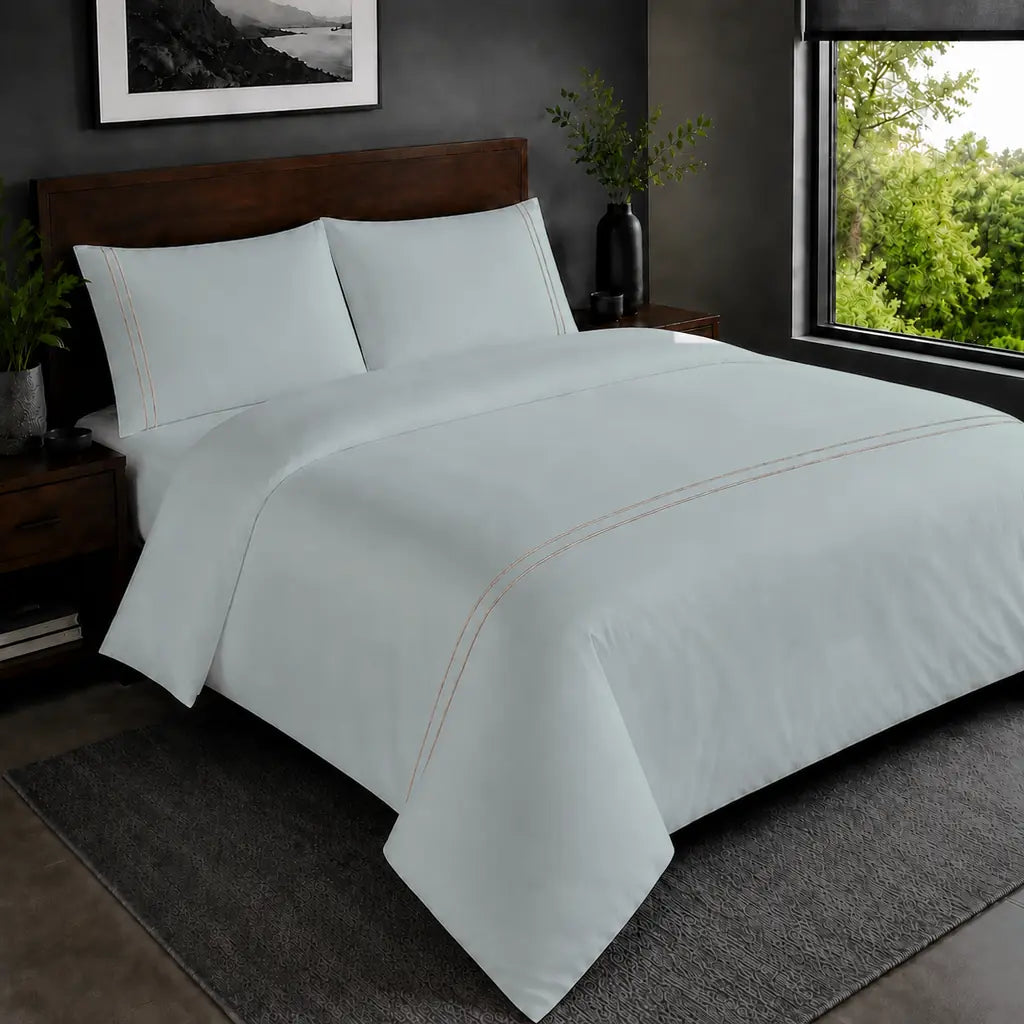 Duck Egg Polycotton Percale 200TC duvet cover set with stone two-row satin stitch in the hero bedroom view.