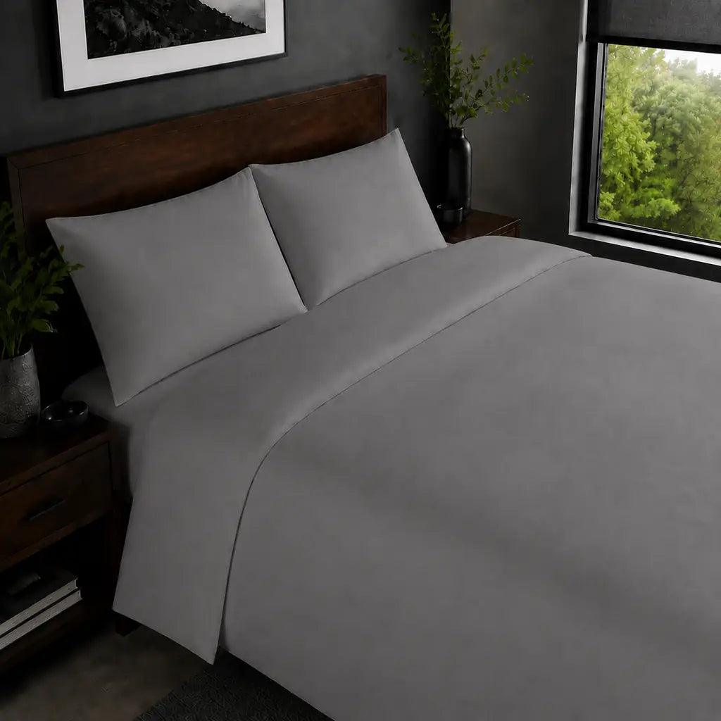 Grey 200TC plain duvet cover with no satin stitch - on the bed - Linen and Co