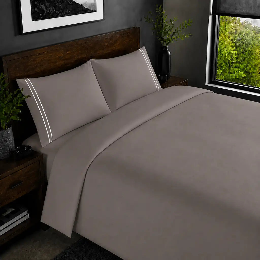 Stone 200TC plain duvet cover with White two row satin stitch - on the bed - Linen and Co