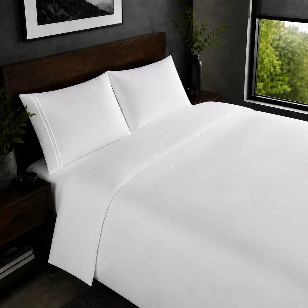 White 200TC plain duvet cover with White two row satin stitch - on the bed - Linen and Co