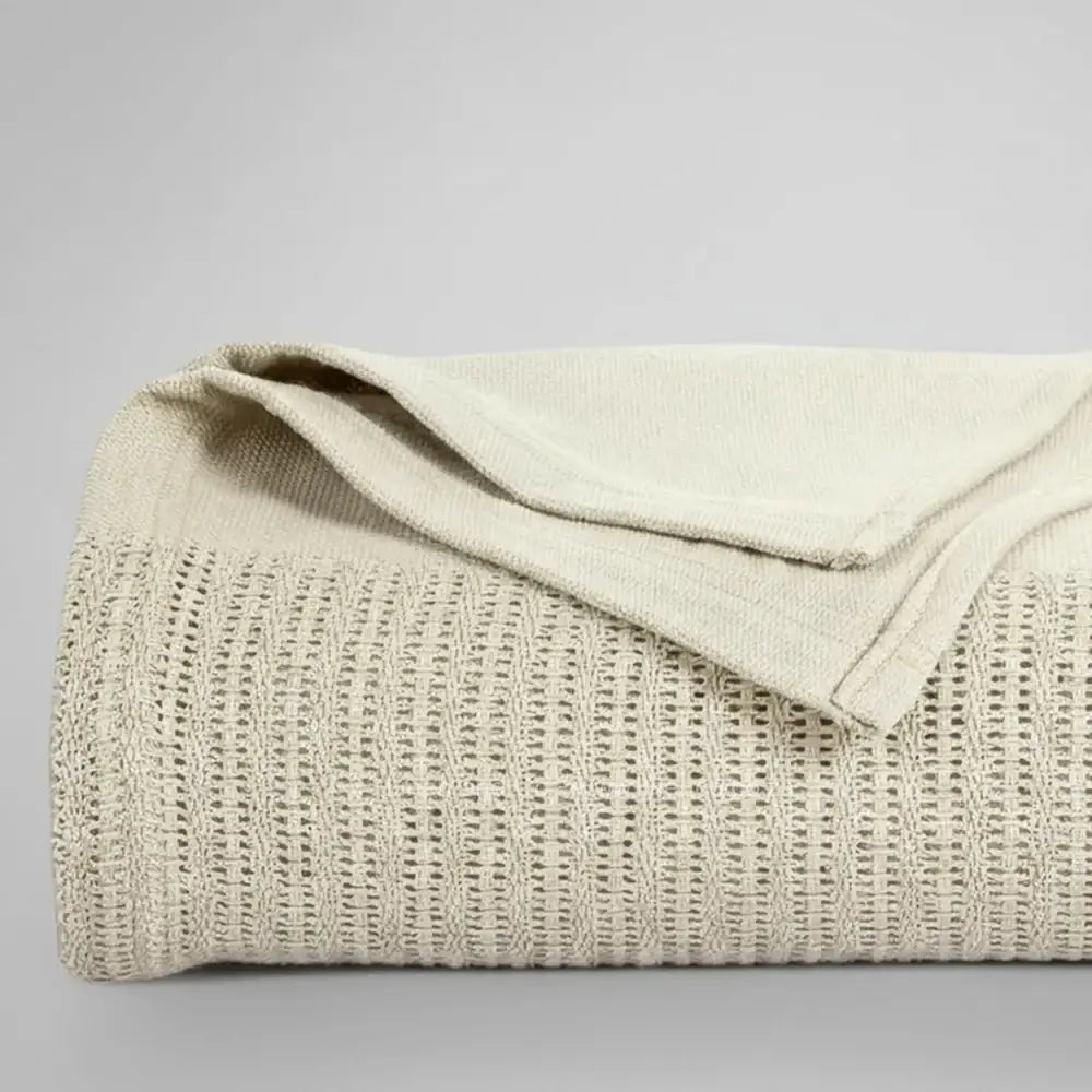 pebble cotton cellular blanket showing textured waffle weave fabric on neutral grey background—soft, breathable bedding by Linen & Co