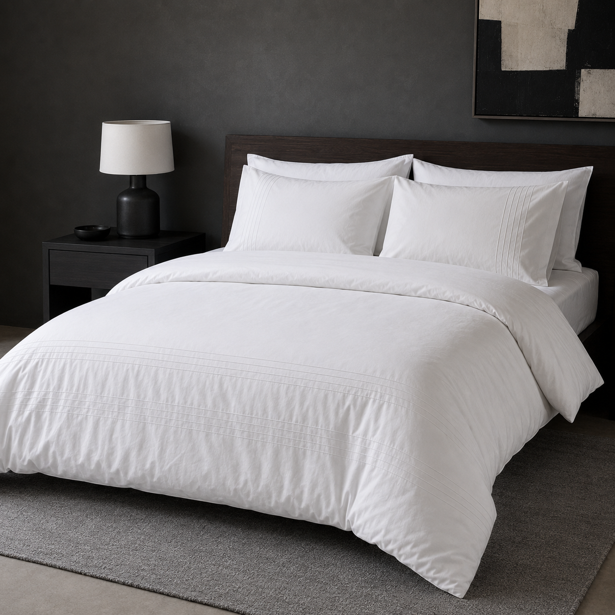 White cotton pintuck duvet cover set styled on a bed