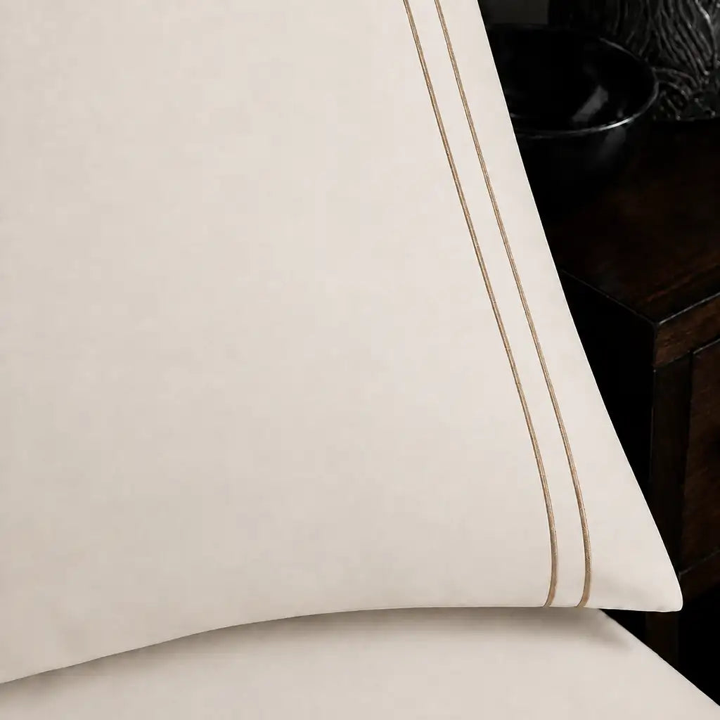 Close-up of cream pillowcase with two row stone satin stitch border by Linen and Co